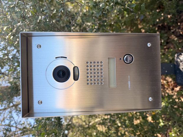 Stainless video intercom panel at a building entrance
