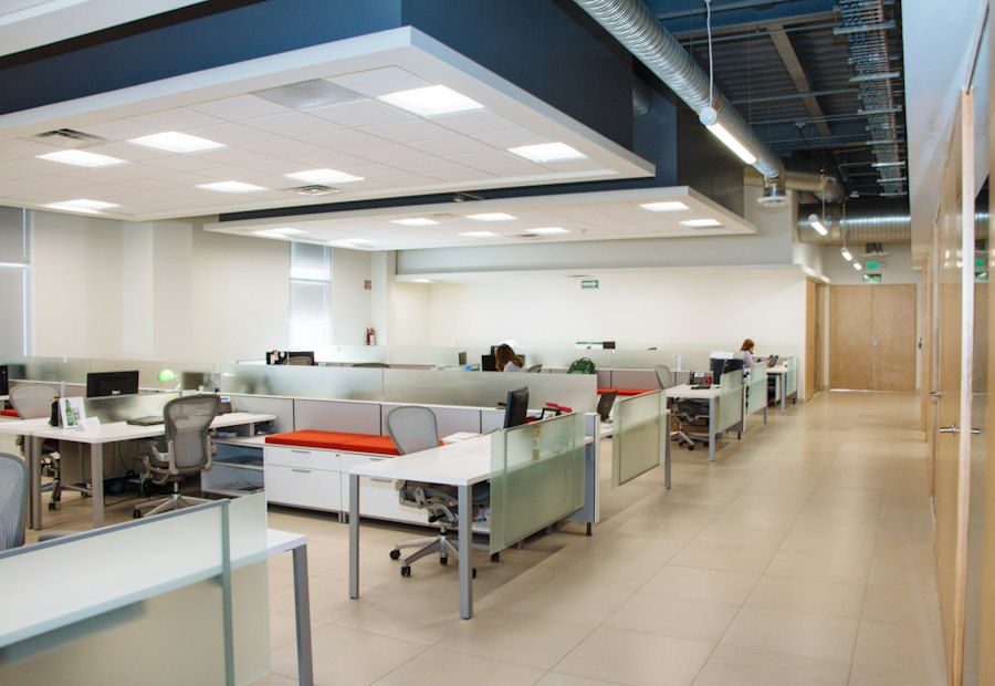 Open-plan commercial office with rows of desks