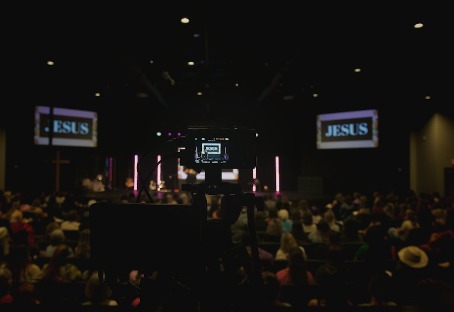 Congregation seated in front of large projection screens
